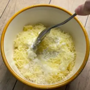 mixing cheese for lasagna