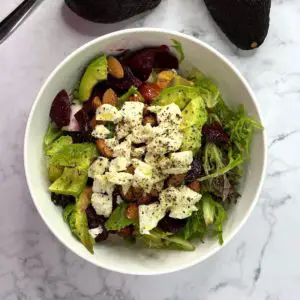 Avocado & beetroot salad with feta cheese, fresh greens, egg and almond