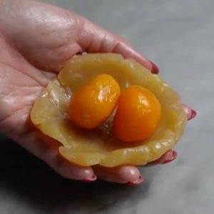 wrap the salted egg yolks with paste