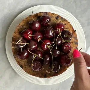 place cherries on fruit cake